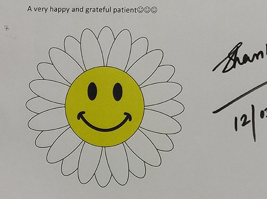 A joyful and thankful patient, expressing gratitude for their care.